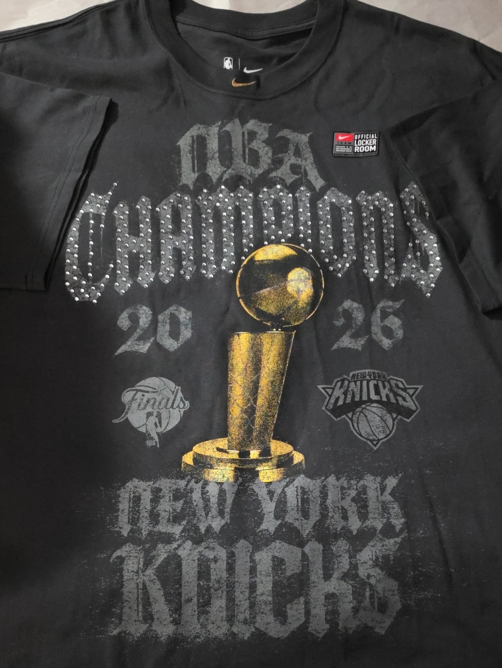 Brand New Knicks Champipnship Nike Black Tee with Gold Trophy Accent Size XXL.